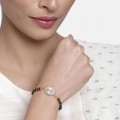 Estele Gold Plated Evil Eye with Black Beads Bracelet with Austrian Crystals & Kundan for Women
Estele Gold Plated Evil Eye with Black Beads Bracelet with Austrian Crystals & Kundan for Women