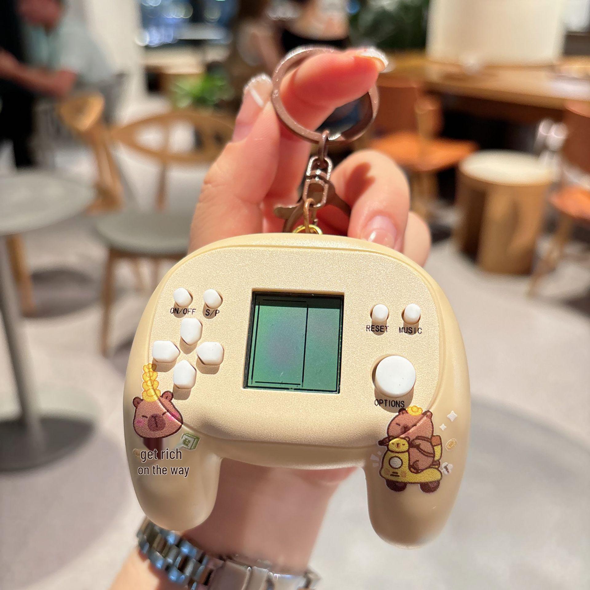 Mini Tetris Handheld Capybara Keychain Game Console Pendant
Mini Tetris Handheld Capybara Keychain Game Console Pendant