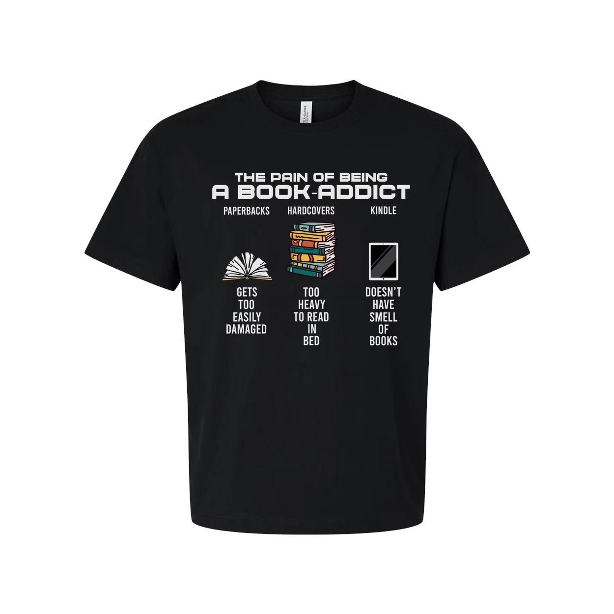 The Pain of Being a Book Addict Graphic Tee With Paperbacks, Hardcovers and Kind L
The Pain of Being a Book Addict Graphic Tee With Paperbacks, Hardcovers and Kind L