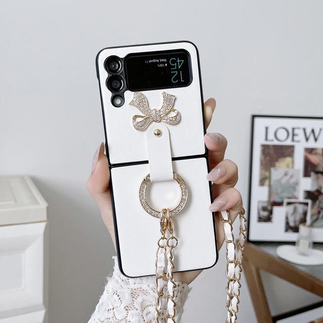 Чехол с ремешком с бриллиантовым кольцом и бантом для Samsung Galaxy Z Flip 4, 5 г, складной кожаный чехол для телефона, противоударные чехлы для Flip3 Flip 3 Flip3 белый
Чехол с ремешком с бриллиантовым кольцом и бантом для Samsung Galaxy Z Flip 4, 5 г, складной кожаный чехол для телефона, противоударные чехлы для Flip3 Flip 3 Flip3 белый