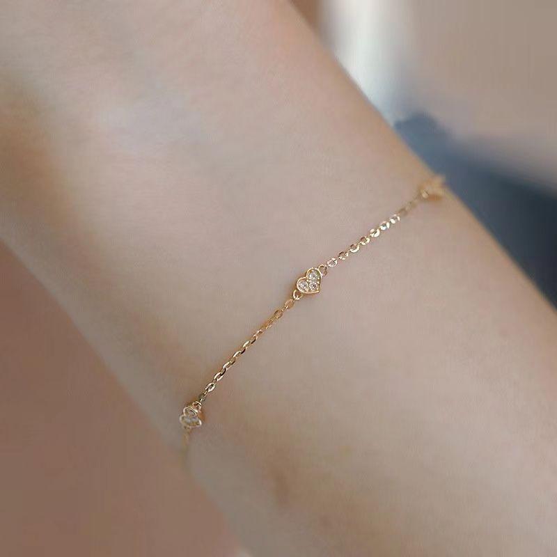 Japanese S925 Sterling Silver Heart-Shaped Bracelet with 14k Gold Plating, featuring Three Small Cold Style Hearts. Simple and Elegant Design.
Japanese S925 Sterling Silver Heart-Shaped Bracelet with 14k Gold Plating, featuring Three Small Cold Style Hearts. Simple and Elegant Design.