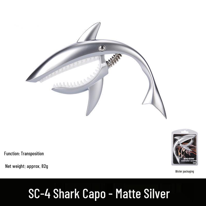 Металлический каподастр для гитары Metal Shark из цинкового сплава с бакелитовыми накладками - Аксессуар для басового инструмента
Металлический каподастр для гитары Metal Shark из цинкового сплава с бакелитовыми накладками - Аксессуар для басового инструмента