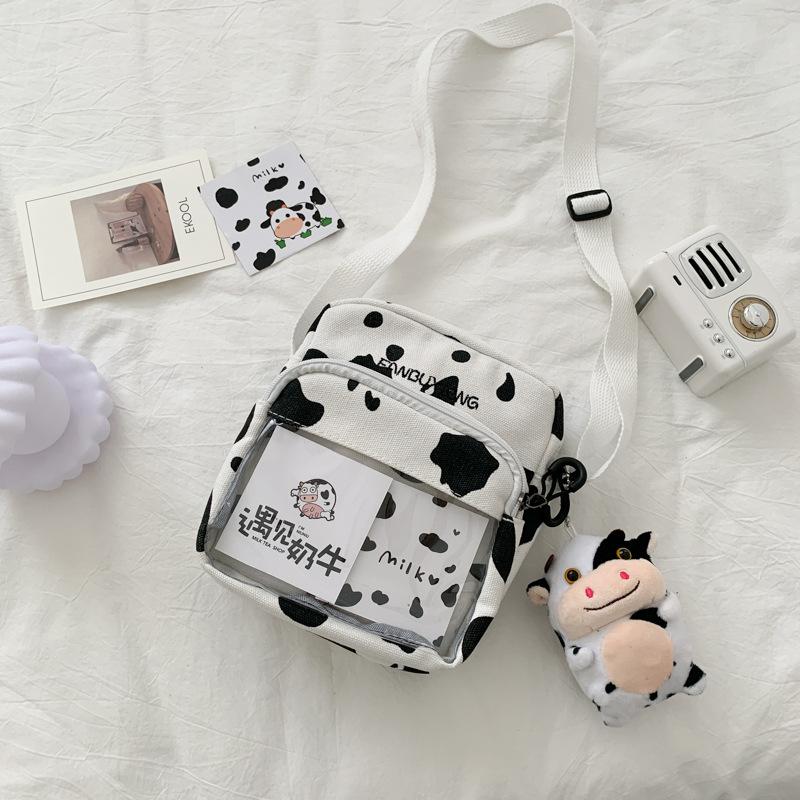 Холщовая сумка новая женская сумка уличный тренд коровья расцветка на плечо сумка-мессенджер маленькая квадратная сумка
Холщовая сумка новая женская сумка уличный тренд коровья расцветка на плечо сумка-мессенджер маленькая квадратная сумка