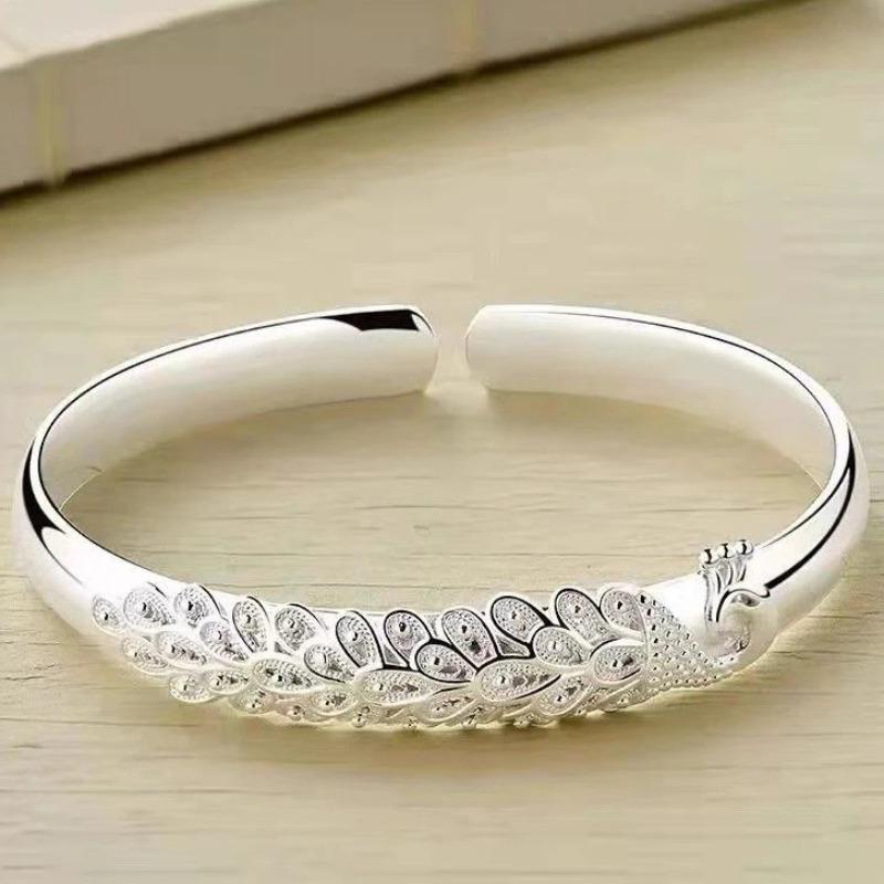 Серебряный Элегантный Браслет-манжета с открывающимся экраном в виде павлина для женщин Модные аксессуары для вечеринки и свадьбы Ювелирный подарок
Серебряный Элегантный Браслет-манжета с открывающимся экраном в виде павлина для женщин Модные аксессуары для вечеринки и свадьбы Ювелирный подарок