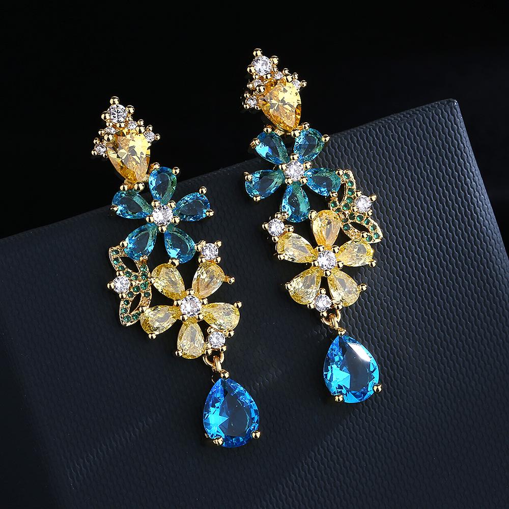 Bohemian Zircon Flower Earrings: Silver Pin, European & American Style, Bold Design for Women
Bohemian Zircon Flower Earrings: Silver Pin, European & American Style, Bold Design for Women
