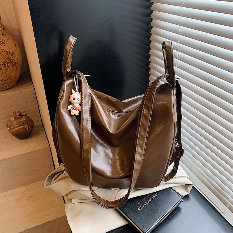 Tote bag women s large-capacity new niche one-shoulder messenger commuter bag casual multi-functional backpack коричневий
Tote bag women s large-capacity new niche one-shoulder messenger commuter bag casual multi-functional backpack коричневий