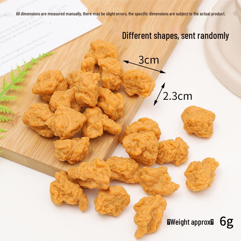 Simulation Edible Chicken Popcorn DIY Toy Keychain Pendant for Food Photography Props.
Simulation Edible Chicken Popcorn DIY Toy Keychain Pendant for Food Photography Props.