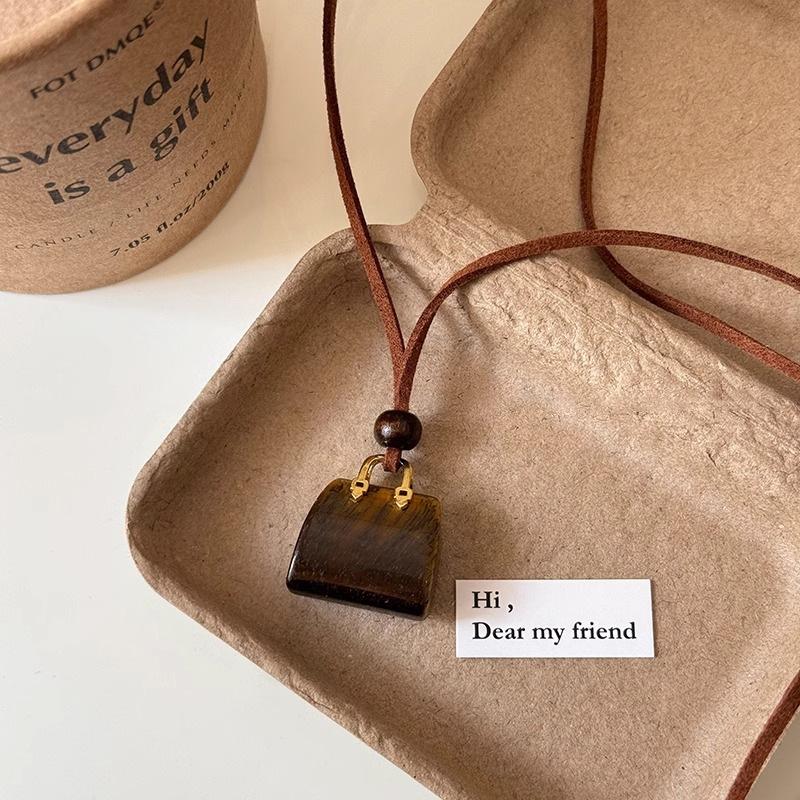 Tiger-eye Stone Handbag Necklace for Women, Small-scale Design with High-end Feel, Long Sweater Chain, Fall-winter Long Pendant Tiger-eye stone
Tiger-eye Stone Handbag Necklace for Women, Small-scale Design with High-end Feel, Long Sweater Chain, Fall-winter Long Pendant Tiger-eye stone