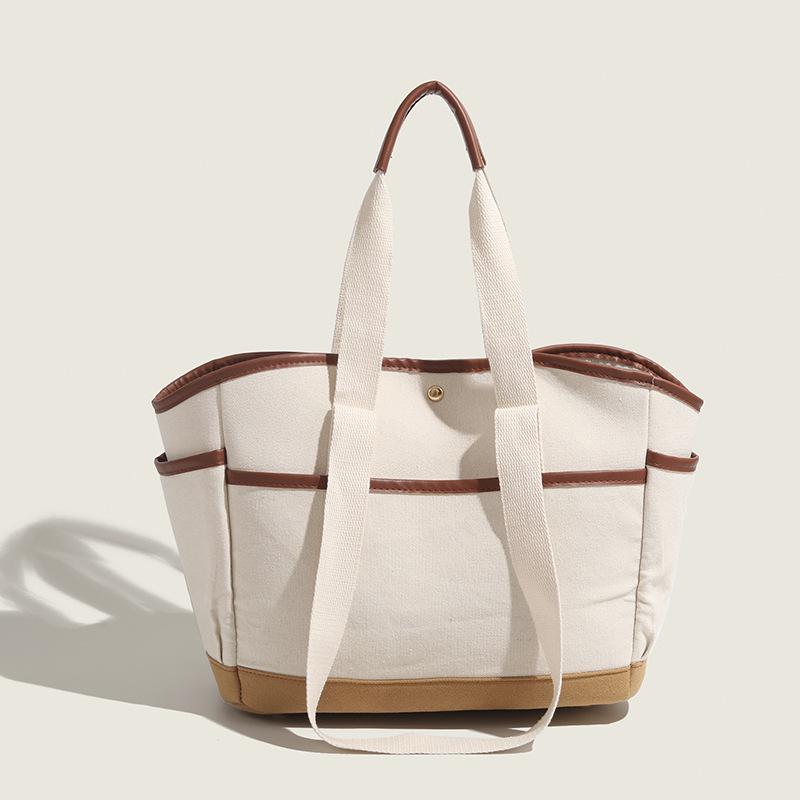 2025 New Korean and Japanese Style Color Block Canvas Mommy Bag Large Capacity Multi-Compartment Single Shoulder Handheld Tote Bag for Women Brown and white patchwork
2025 New Korean and Japanese Style Color Block Canvas Mommy Bag Large Capacity Multi-Compartment Single Shoulder Handheld Tote Bag for Women Brown and white patchwork