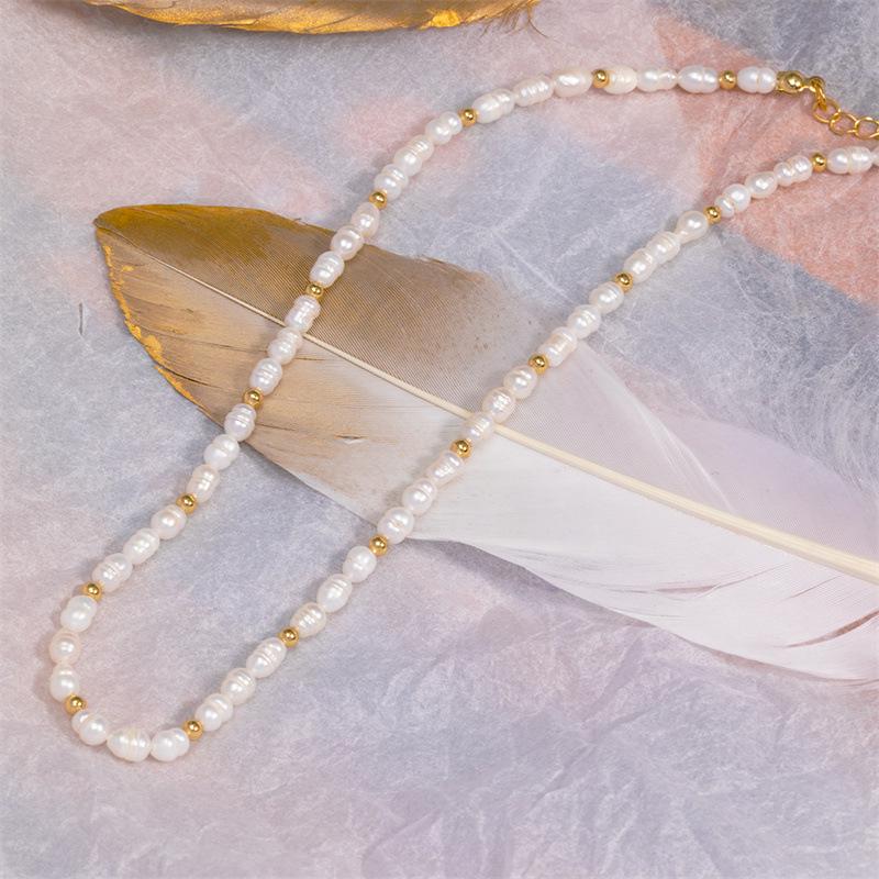 Autumn/Winter Natural Pearl Copper Ball Necklace - European & American INS Style Fashion, Light Luxury Design.
Autumn/Winter Natural Pearl Copper Ball Necklace - European & American INS Style Fashion, Light Luxury Design.