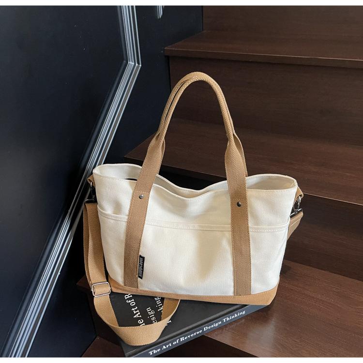 Canvas bag women s large capacity 2025 new summer versatile messenger bag casual portable college student tote bag хакі
Canvas bag women s large capacity 2025 new summer versatile messenger bag casual portable college student tote bag хакі
