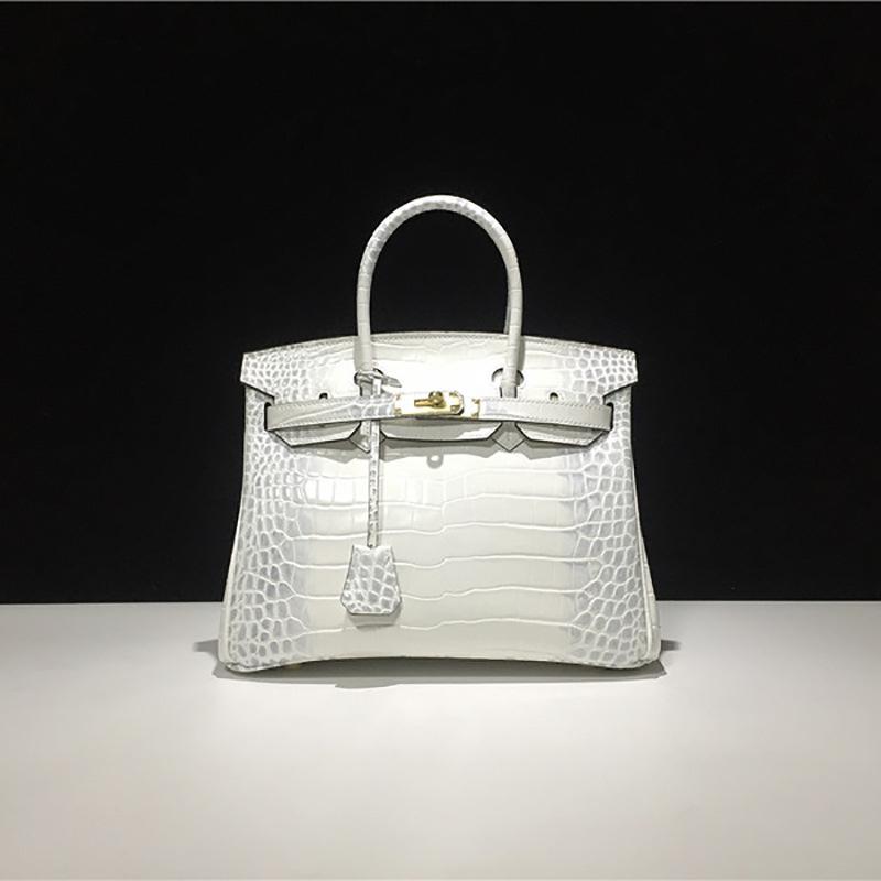 Кожаная сумка с тиснением под крокодила платинового цвета, большой вместимости, модная и универсальная женская сумка, сумка через плечо для ношения в руке, портативная 30cm
Кожаная сумка с тиснением под крокодила платинового цвета, большой вместимости, модная и универсальная женская сумка, сумка через плечо для ношения в руке, портативная 30cm