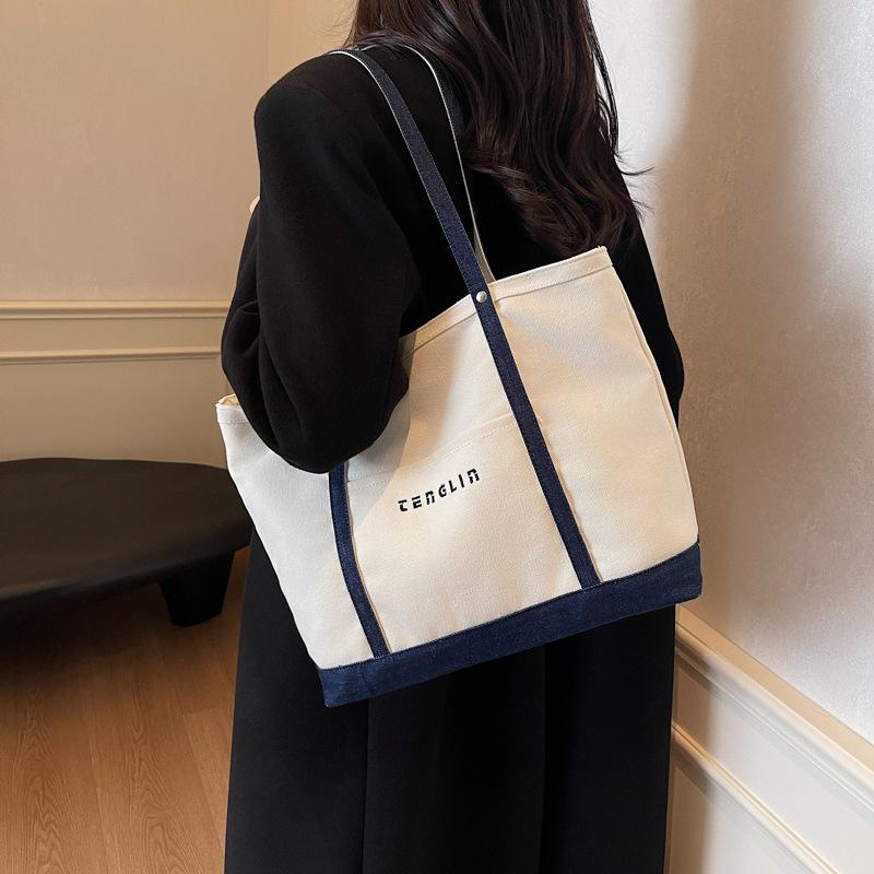 Letter embroidered canvas shoulder bag women s large capacity tote bag autumn and winter fashion travel tote bag
Letter embroidered canvas shoulder bag women s large capacity tote bag autumn and winter fashion travel tote bag