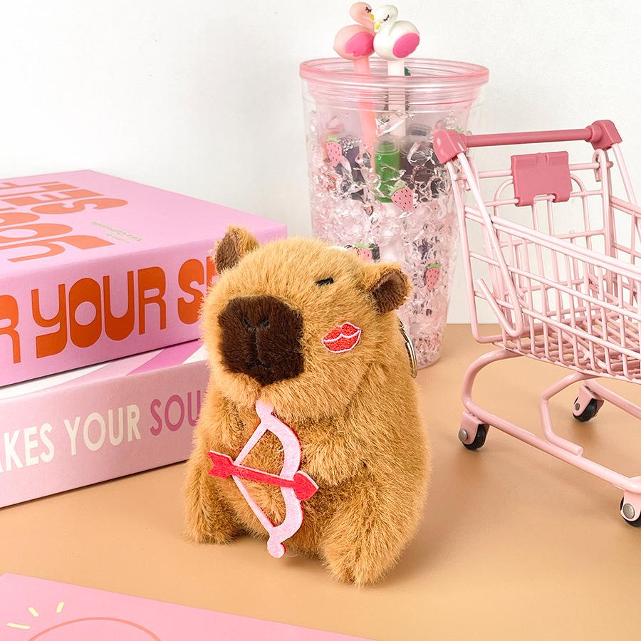 Cartoon Love Book Capybara Plush Doll Creative Cupid Arrow Kapibala Doll Bag Keychain Pendant Height about 11cm
Cartoon Love Book Capybara Plush Doll Creative Cupid Arrow Kapibala Doll Bag Keychain Pendant Height about 11cm