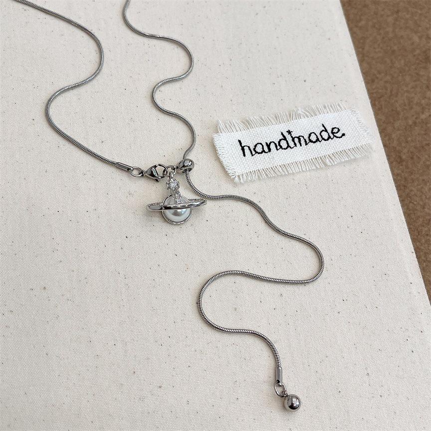 2024 Saturn Pearl Pendant Necklace: High-Grade Adjustable Titanium Steel Sweater Chain for Women
2024 Saturn Pearl Pendant Necklace: High-Grade Adjustable Titanium Steel Sweater Chain for Women