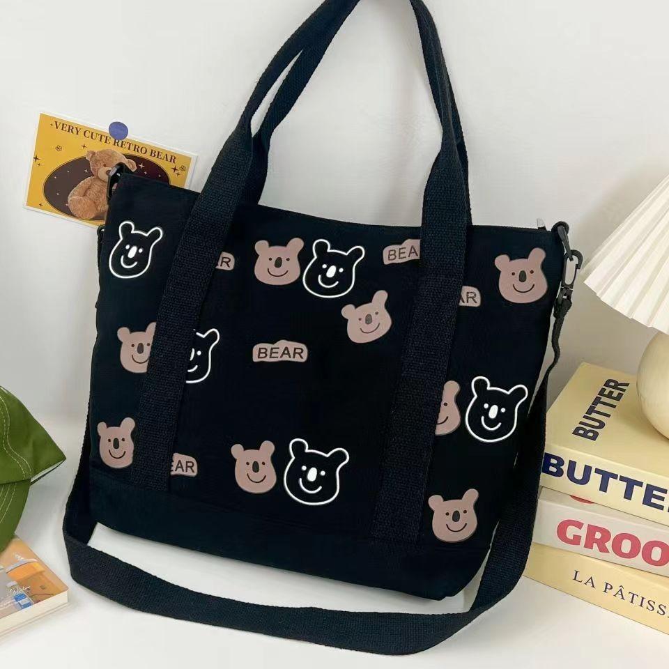 Large capacity versatile canvas shoulder bag bag female student make-up bag portable shopping bag cute AB bear bag
Large capacity versatile canvas shoulder bag bag female student make-up bag portable shopping bag cute AB bear bag
