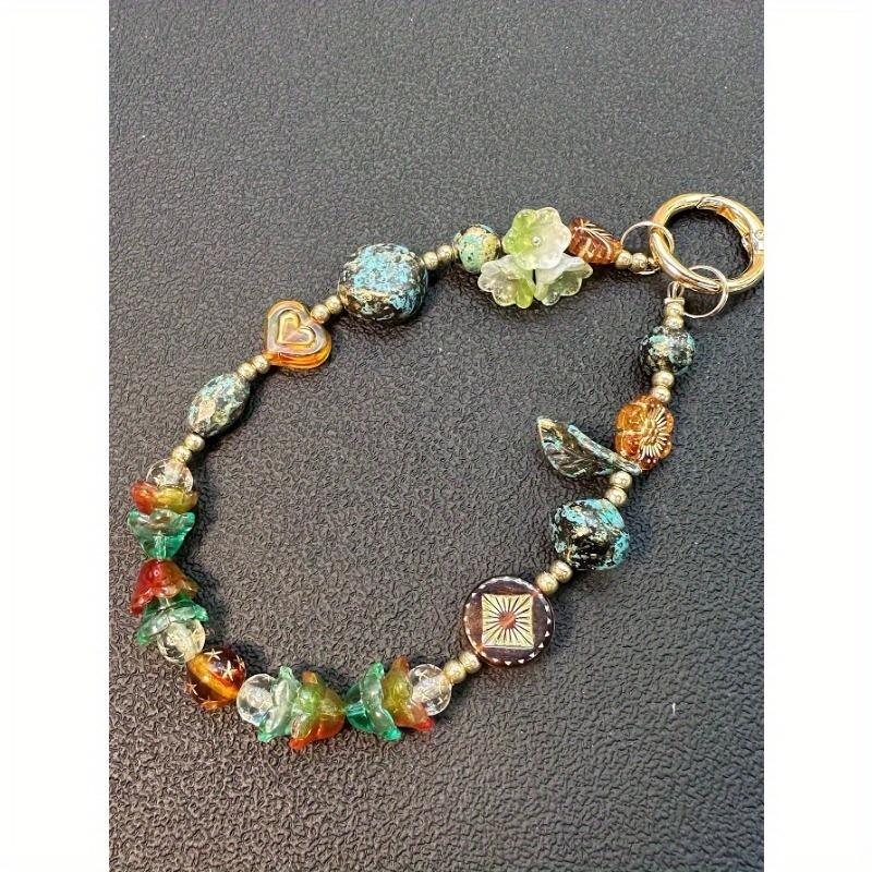 Модный женский шнурок для телефона с бусинами, изысканный брелок-держатель для телефона с экзотическим цветком, универсальный аксессуар one-size зелёный
Модный женский шнурок для телефона с бусинами, изысканный брелок-держатель для телефона с экзотическим цветком, универсальный аксессуар one-size зелёный