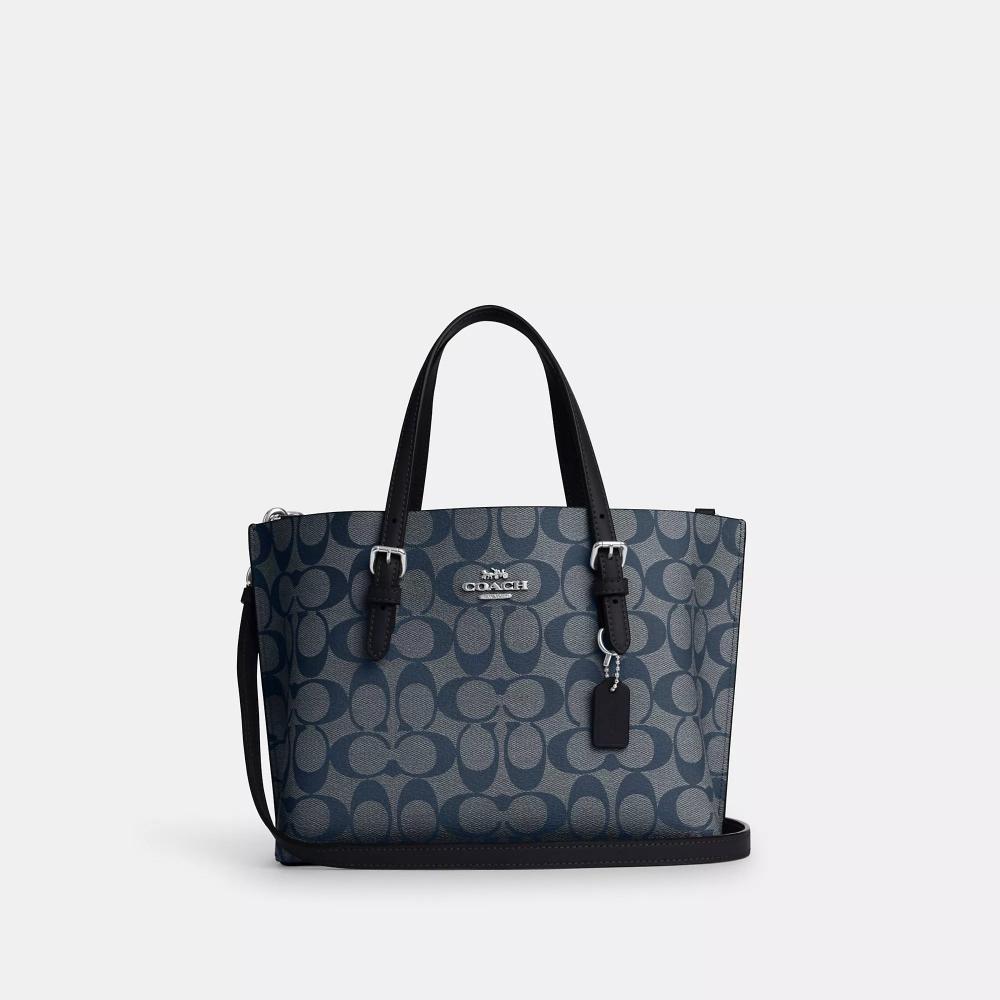 Сумка-тоут Coach Mollie 25 из канвы Signature серебристого цвета, темно-синего цвета из денима
Сумка-тоут Coach Mollie 25 из канвы Signature серебристого цвета, темно-синего цвета из денима
