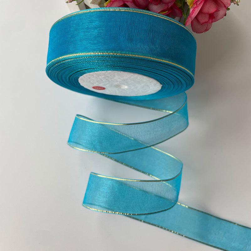 2.5cm Gold Edge Snow Yarn Ribbon for DIY Hair Accessories, Gift Packaging, Cake Decoration, and Floral Bows.
2.5cm Gold Edge Snow Yarn Ribbon for DIY Hair Accessories, Gift Packaging, Cake Decoration, and Floral Bows.