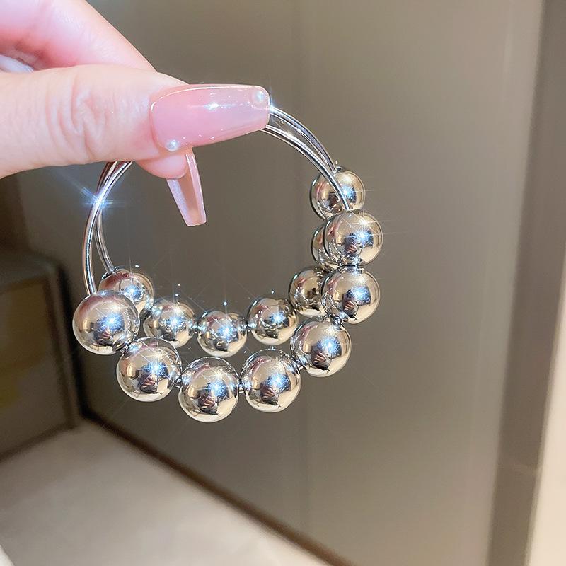 Silver Geometric Metallic Hoop Earrings: Large Round Beads, Contemporary European & American Style
Silver Geometric Metallic Hoop Earrings: Large Round Beads, Contemporary European & American Style