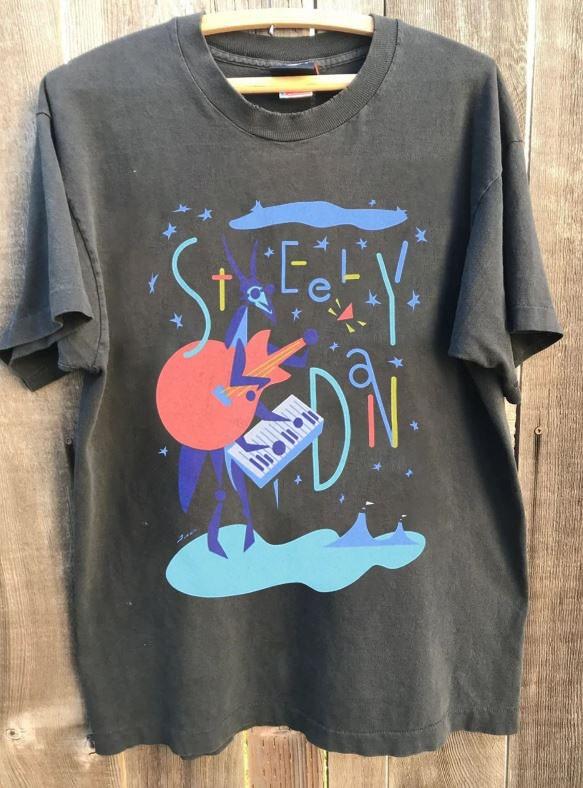 1994 Steely Dan Tour Shirt Classic Style Band Charcoal Unisex T shirt WA4141 Unisex T-Shirt L
1994 Steely Dan Tour Shirt Classic Style Band Charcoal Unisex T shirt WA4141 Unisex T-Shirt L