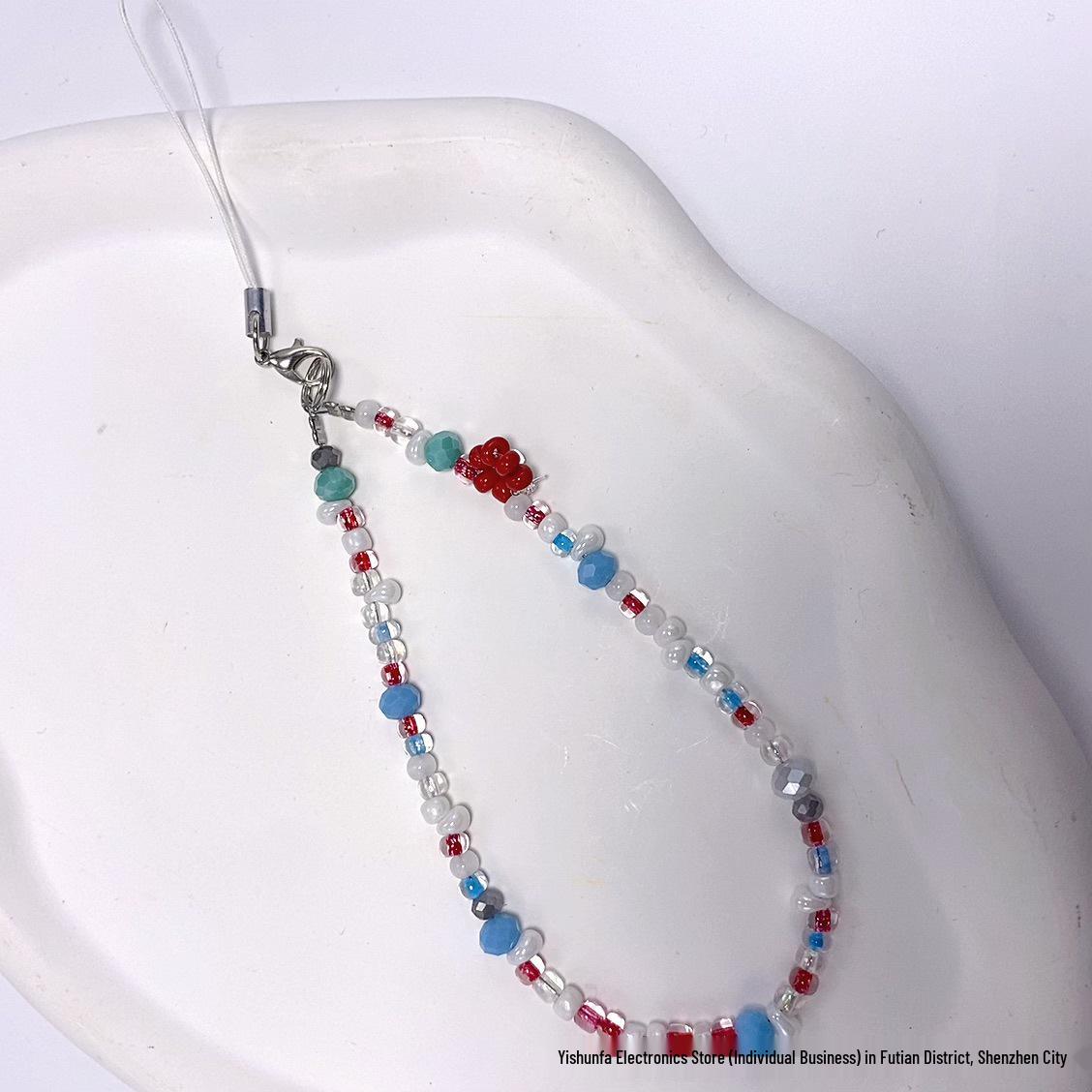 Beaded New Year Cartoon Lanyard: Cute Red Phone, Bag, Key, and Earphone Charm.
Beaded New Year Cartoon Lanyard: Cute Red Phone, Bag, Key, and Earphone Charm.
