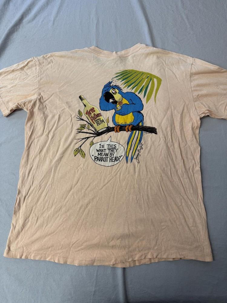 Винтажная футболка Jimmy Buffet 1986 Wasted Away 3 Feathers Rum XL Унисекс L
Винтажная футболка Jimmy Buffet 1986 Wasted Away 3 Feathers Rum XL Унисекс L