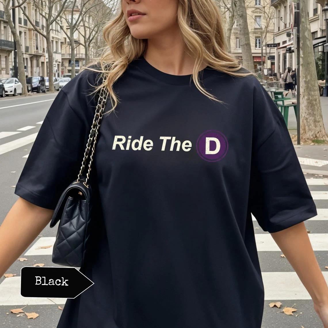 Ride The D LA Metro Meme Shirt – Los Angeles Transit Humor Graphic Tee S
Ride The D LA Metro Meme Shirt – Los Angeles Transit Humor Graphic Tee S
