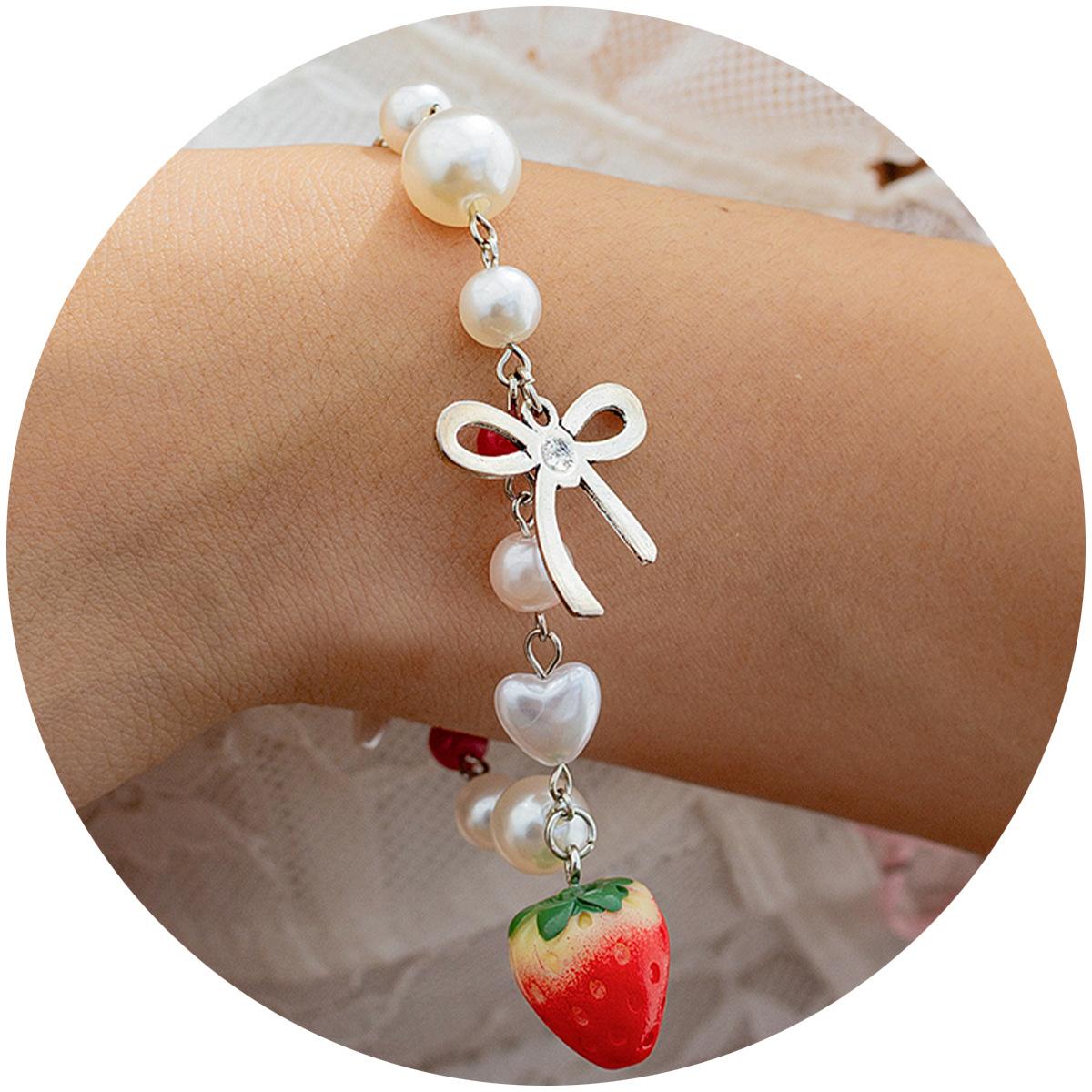 Bracelet fresh pastoral strawberry bow bracelet, temperament imitation pearl vacation hand
Bracelet fresh pastoral strawberry bow bracelet, temperament imitation pearl vacation hand