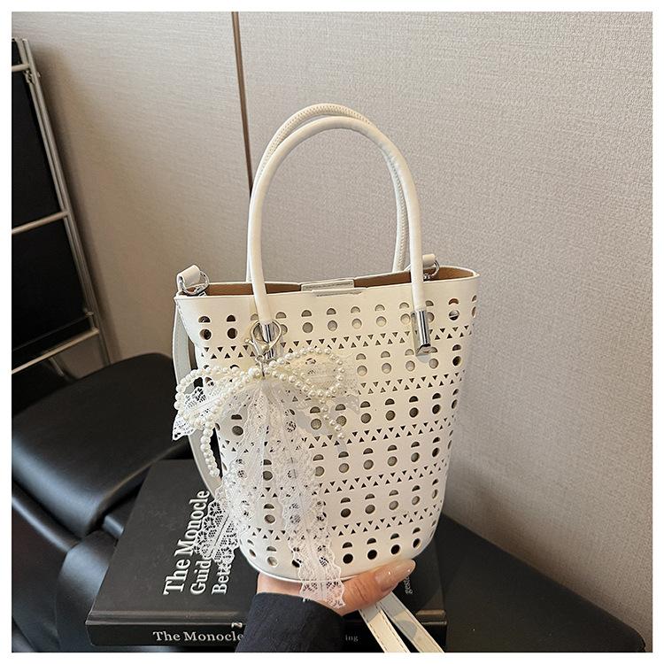 This year s popular small bag women s summer 2025 new niche messenger bag hollow mother bucket bag білий
This year s popular small bag women s summer 2025 new niche messenger bag hollow mother bucket bag білий