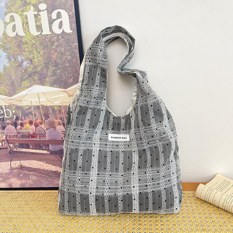 Summer large-capacity polka dot canvas messenger bag niche daily commute underarm shoulder tote bag women s new model
Summer large-capacity polka dot canvas messenger bag niche daily commute underarm shoulder tote bag women s new model