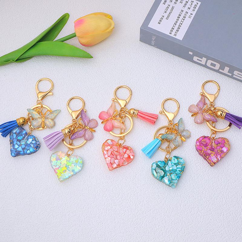 Exquisite Heart Charms Keychains With Butterfly Tassel Shiny Sequin Filled Resin Keyrings Women Bag Ornaments Car Trinket Gifts
Exquisite Heart Charms Keychains With Butterfly Tassel Shiny Sequin Filled Resin Keyrings Women Bag Ornaments Car Trinket Gifts