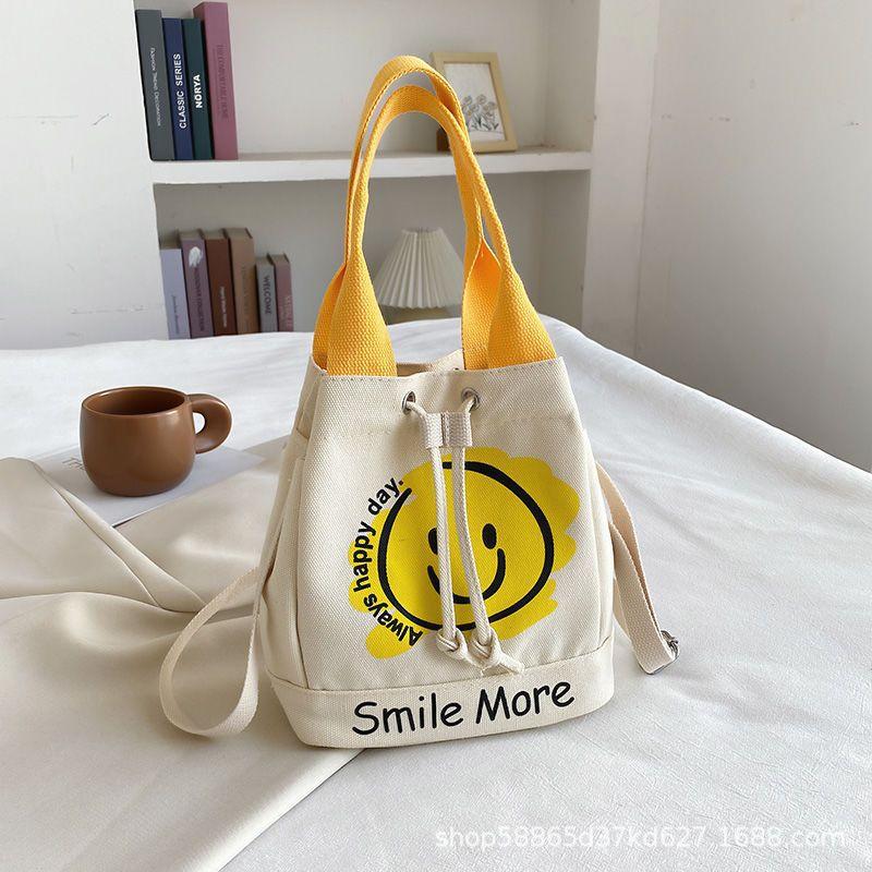 New graffiti smiley face canvas bag, simple and portable handbag, cute messenger bag, bag woman жовтий
New graffiti smiley face canvas bag, simple and portable handbag, cute messenger bag, bag woman жовтий