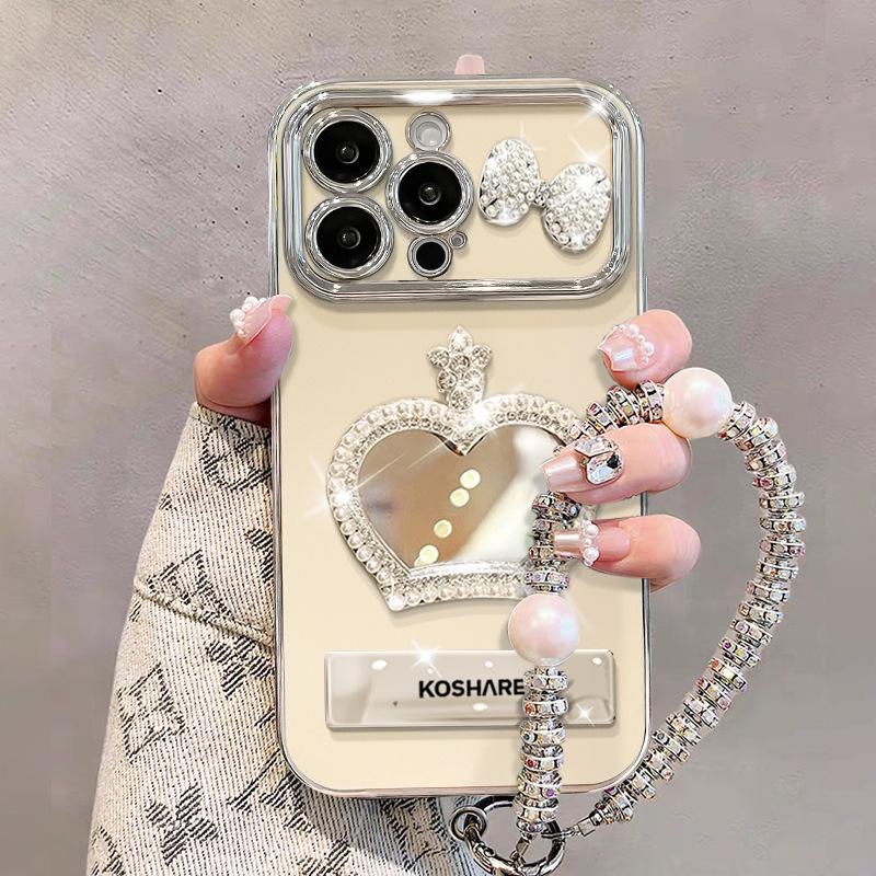 Crown Mirror Bow Doll Chain Suitable for Apple 16 Mobile Phone Case with Bracket 15 Electroplated Large Window 14 Women iphone 16
Crown Mirror Bow Doll Chain Suitable for Apple 16 Mobile Phone Case with Bracket 15 Electroplated Large Window 14 Women iphone 16