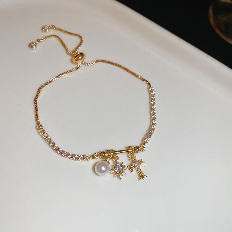 Elegant Zircon Flower & Pearl Cross Bracelet: Fashionable, Exquisite, Versatile
Elegant Zircon Flower & Pearl Cross Bracelet: Fashionable, Exquisite, Versatile