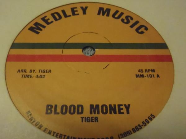 12inch Record TIGER Blood Money MM101 Medley Music US Reggae Ska Dub Used
12inch Record TIGER Blood Money MM101 Medley Music US Reggae Ska Dub Used
