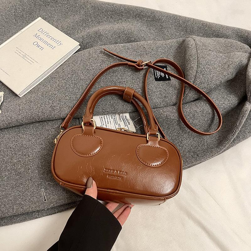 Популярная горячо продаваемая премиальная портативная сумка Boston из масляной вощеной кожи Maillard, женская универсальная дорожная простая сумка-мессенджер
Популярная горячо продаваемая премиальная портативная сумка Boston из масляной вощеной кожи Maillard, женская универсальная дорожная простая сумка-мессенджер