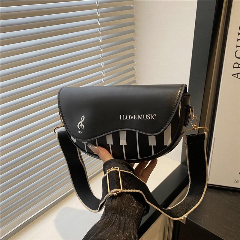 Personalized piano music note simple 2025 new fashion girl sweet shoulder portable small messenger women s bag
Personalized piano music note simple 2025 new fashion girl sweet shoulder portable small messenger women s bag