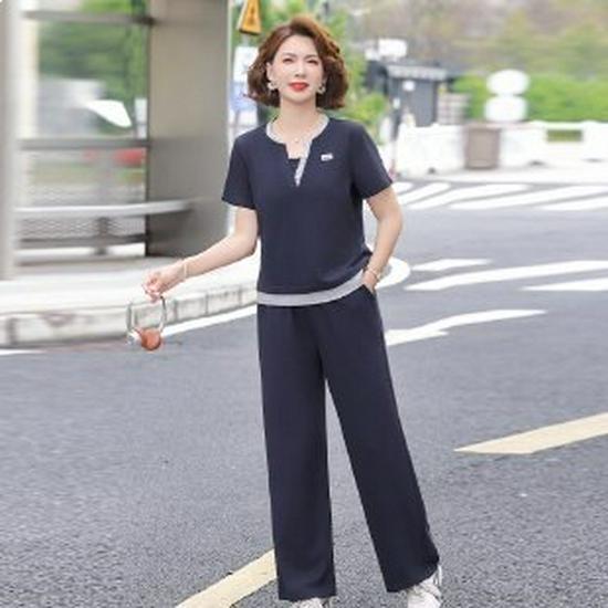 Mom s Vintage Style Summer Sportswear Set: 40s-50s Inspired Short Sleeve Two-Piece for Middle-Aged Women 5XL темно-синього кольору
Mom s Vintage Style Summer Sportswear Set: 40s-50s Inspired Short Sleeve Two-Piece for Middle-Aged Women 5XL темно-синього кольору