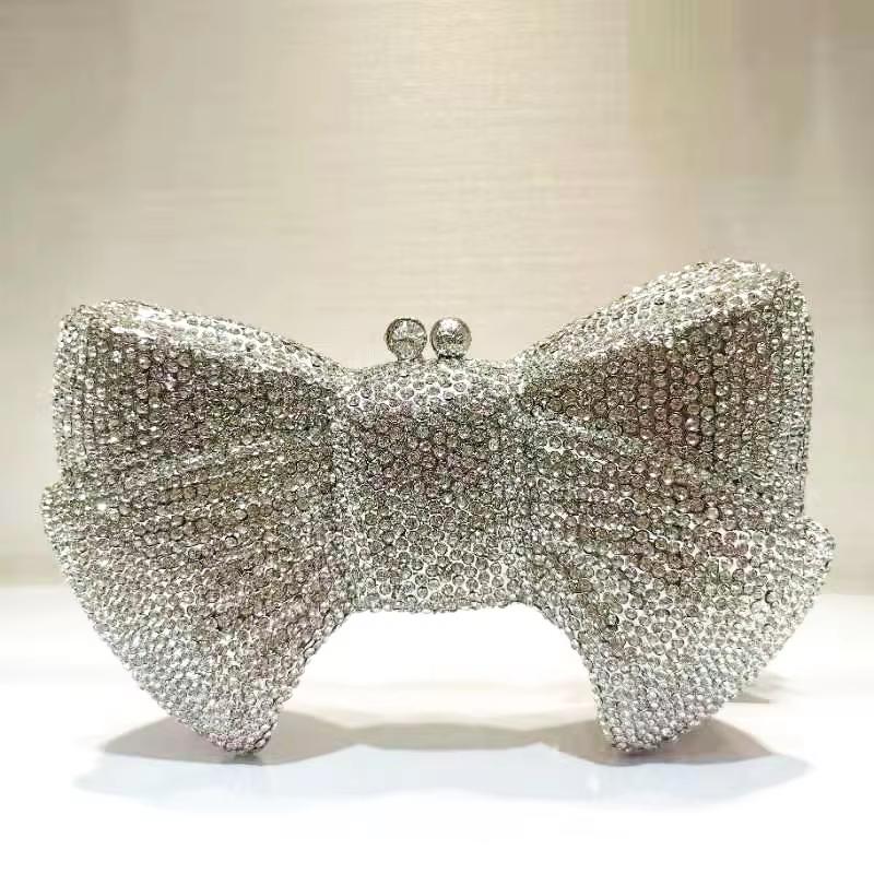 WHTUOHENG Silver Rhinestone Bow Shape Evening Clutch Bag Luxury Diamond Party Clutches Female Wedding Handbag Lady Prom Bags 21cmX14cmX5cm
WHTUOHENG Silver Rhinestone Bow Shape Evening Clutch Bag Luxury Diamond Party Clutches Female Wedding Handbag Lady Prom Bags 21cmX14cmX5cm