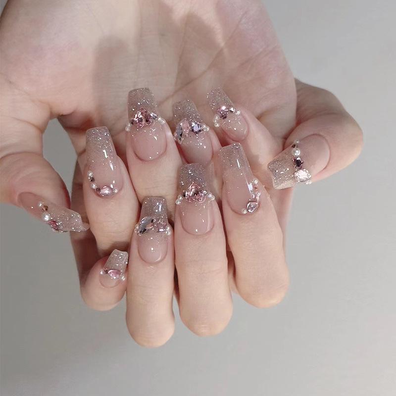 Glitter & Rhinestone Nude Press-On Nails with Pearl Tips, Reusable & Removable Gold Plated Top Coat
Glitter & Rhinestone Nude Press-On Nails with Pearl Tips, Reusable & Removable Gold Plated Top Coat