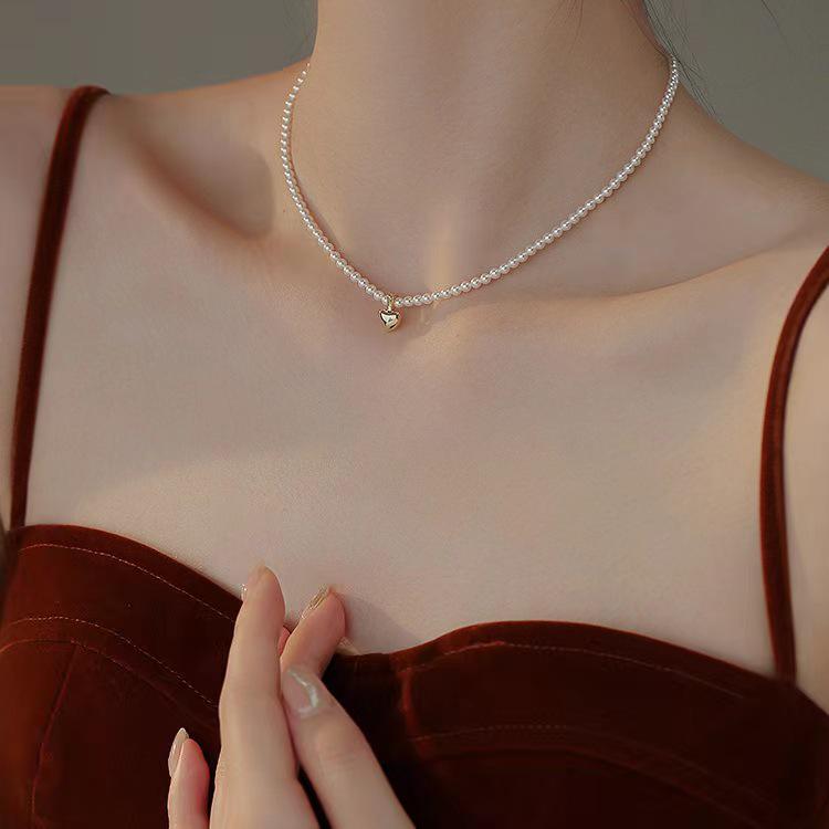 Elegant NK-97 Copper Heart Pearl Choker Clavicle Necklace - Versatile French Style for Women
Elegant NK-97 Copper Heart Pearl Choker Clavicle Necklace - Versatile French Style for Women