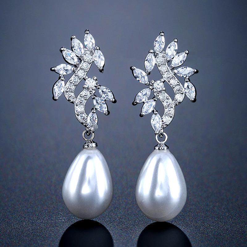 RAKOL Geometric Floral Pearl Dangle Earrings: Elegant Korean Style with Micro-set Zircon Detailing for Women.
RAKOL Geometric Floral Pearl Dangle Earrings: Elegant Korean Style with Micro-set Zircon Detailing for Women.
