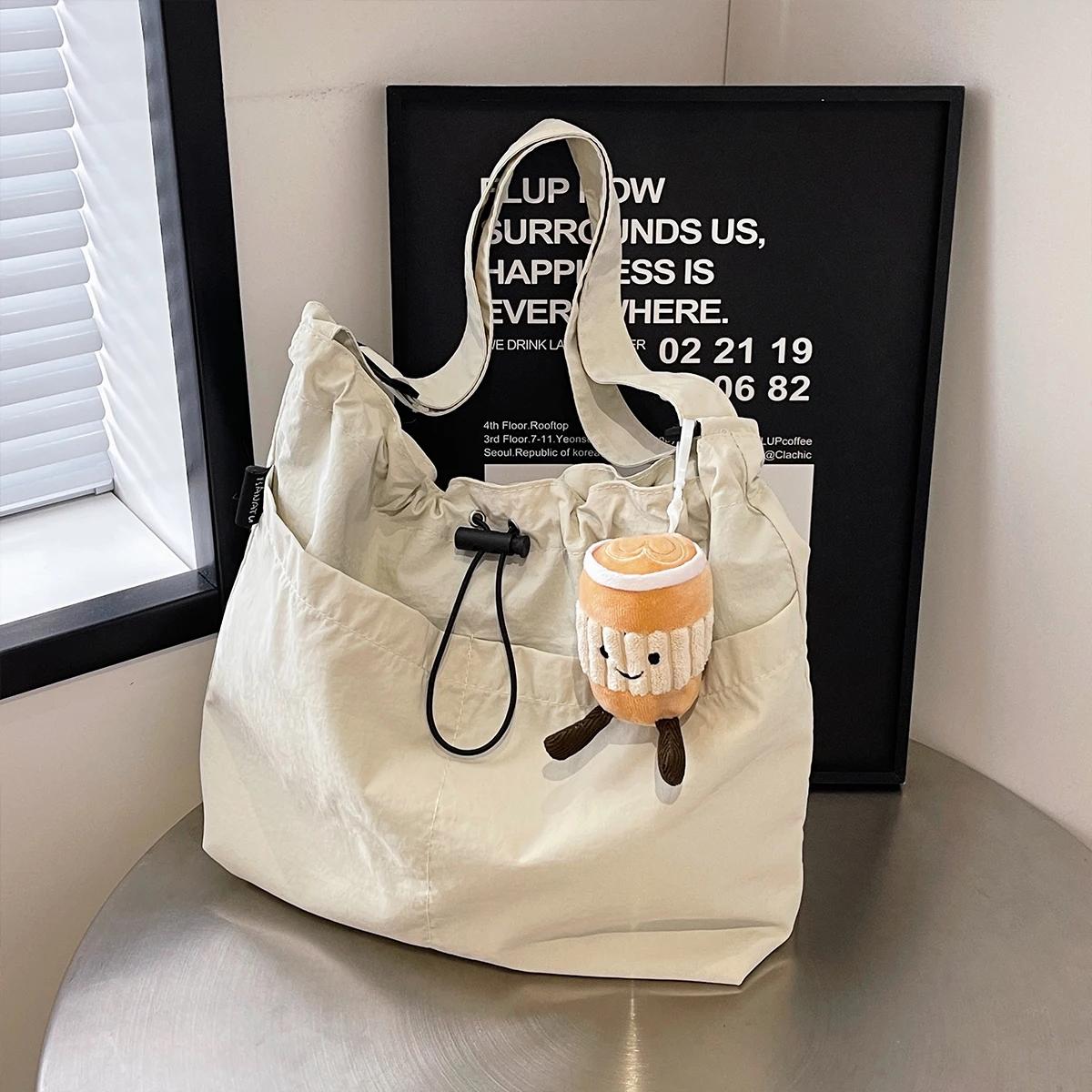 Tote Bag For Women Lightweight Nylon With Bucket Doll Charm Drawstring Wrinkle And Magnetic Closure Shoulder Bag Daily Use
Tote Bag For Women Lightweight Nylon With Bucket Doll Charm Drawstring Wrinkle And Magnetic Closure Shoulder Bag Daily Use