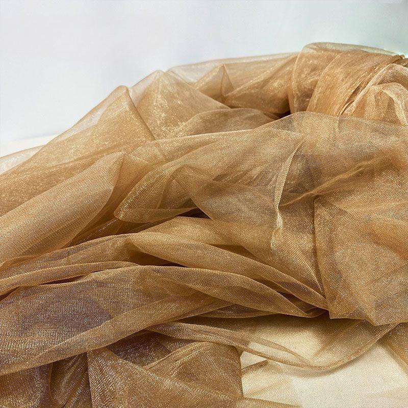 Soft slightly shimmering delicate transparent net fabric suitable for wedding dresses formal gowns and designer clothing fabrics 1.6M&1M золотий
Soft slightly shimmering delicate transparent net fabric suitable for wedding dresses formal gowns and designer clothing fabrics 1.6M&1M золотий