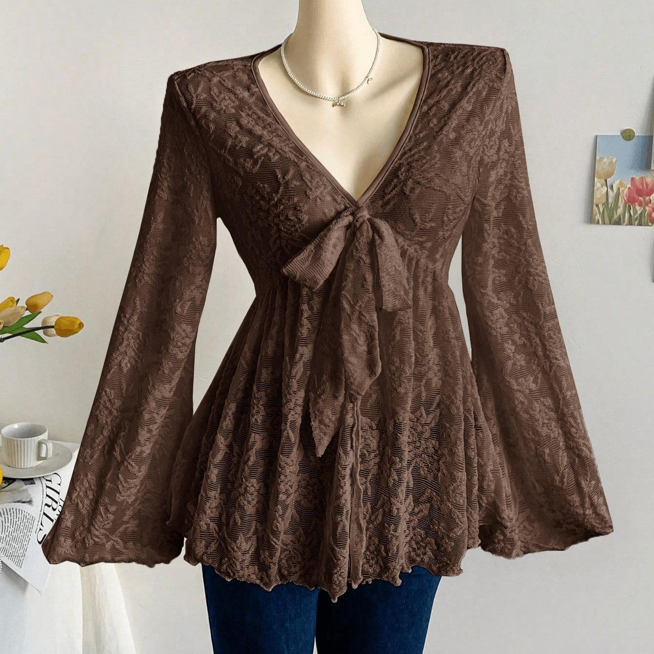 Brown Floral Print Deep V-Neck Long Sleeve Blouse with Bow and Ruffle Hem XL темно-коричневого кольору
Brown Floral Print Deep V-Neck Long Sleeve Blouse with Bow and Ruffle Hem XL темно-коричневого кольору