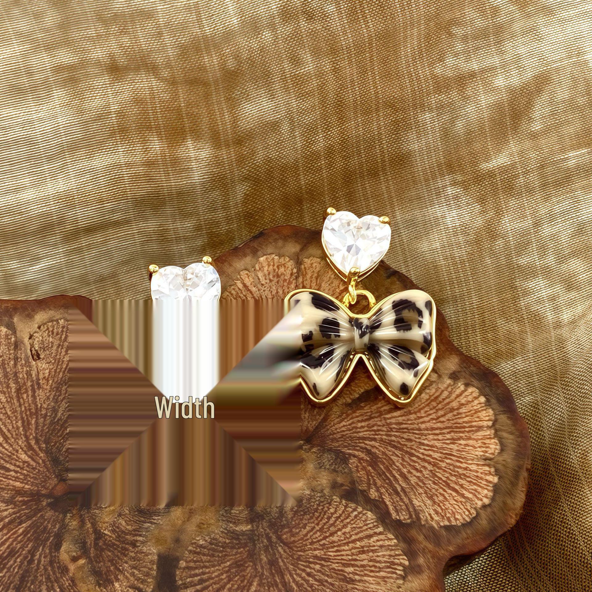 French Niche Bow Heart Cubic Zirconia Drop Earrings: Trendy, High-End Fashion Jewelry
French Niche Bow Heart Cubic Zirconia Drop Earrings: Trendy, High-End Fashion Jewelry