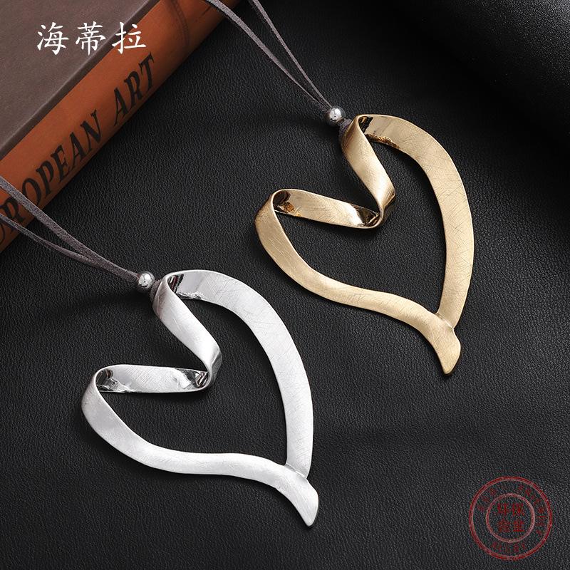 New hollow brushed love alloy pendant, irregular peach heart women s long leather rope sweater chain
New hollow brushed love alloy pendant, irregular peach heart women s long leather rope sweater chain