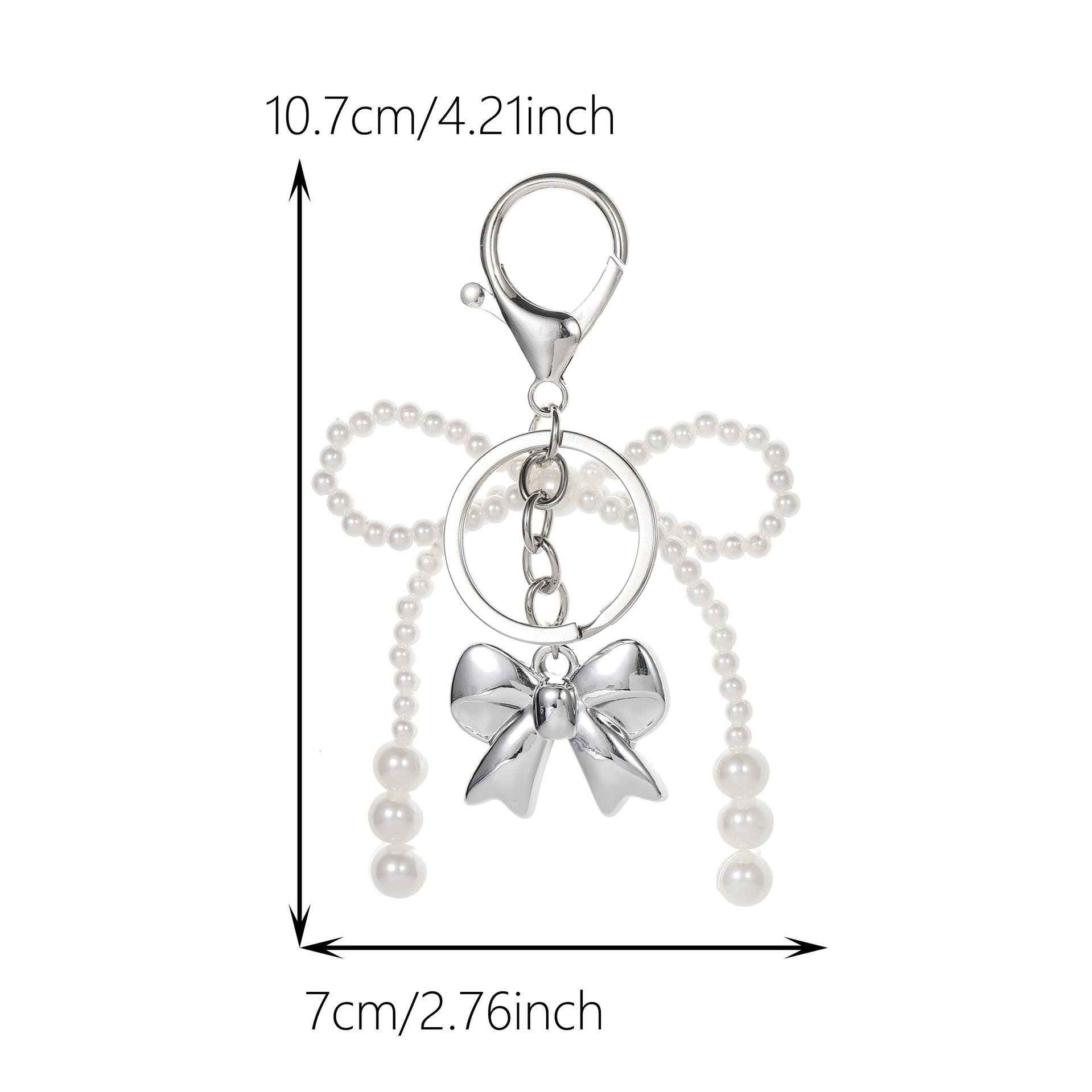 Pearl Bow Heart Keychain 3D Bag Charm Ornament in Gold/Silver
Pearl Bow Heart Keychain 3D Bag Charm Ornament in Gold/Silver