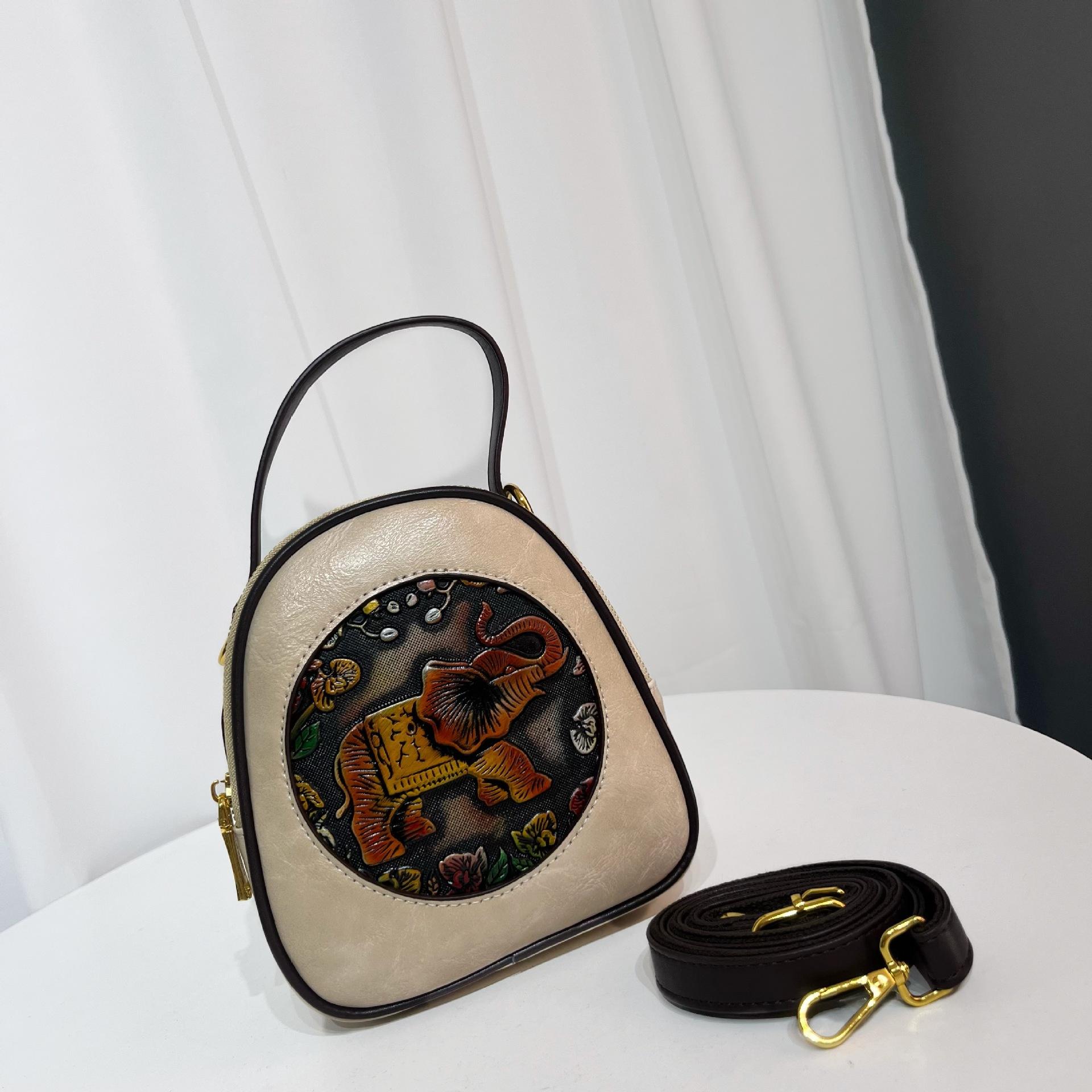 Этническая винтажная круглая сумка кроссбоди - Дамская сумка на плечо с ручным тиснением, минималистичная текстура, вместительная сумка для通勤
Этническая винтажная круглая сумка кроссбоди - Дамская сумка на плечо с ручным тиснением, минималистичная текстура, вместительная сумка для通勤